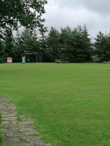 a large green field with a goal at Villa River Rose in Jõesuu