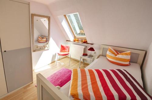 Кровать или кровати в номере Ferienwohnung Nordstern