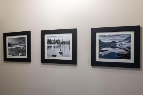 four framed photographs are hanging on a wall at Thornbank House Offering Breakfast and with the use of Free Local Health Club in Windermere