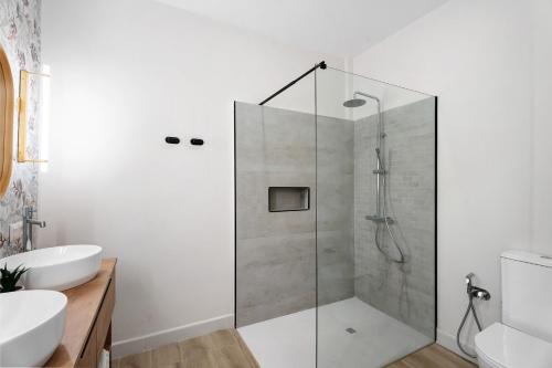 a bathroom with a shower with a glass door at Loft The Pa By Paramount Holidays in Adeje