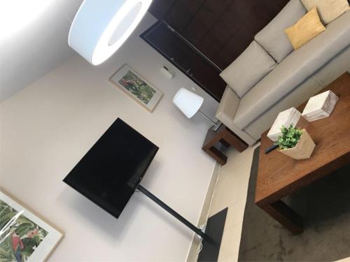 TV a/nebo společenská místnost v ubytování Salgados Apartment