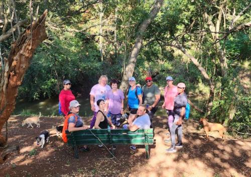 a group of people posing for a picture on a bench at Imbabali Retreat & Venue in Magaliesburg
