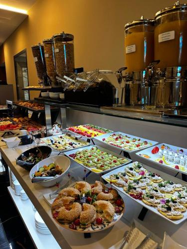a buffet filled with lots of different types of food at Hotel BH San Francisco Alicante in Alicante