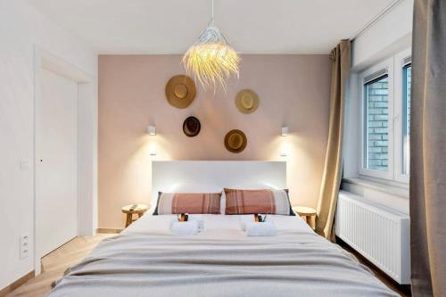 A bed or beds in a room at Albane - modern 2 slaapkamer appartement