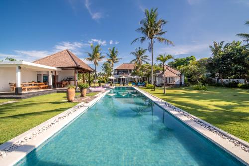 an image of a swimming pool at a villa at BougainVilla - Oceanfront villa with Cook, ideal for Weddings and Events in Keramas