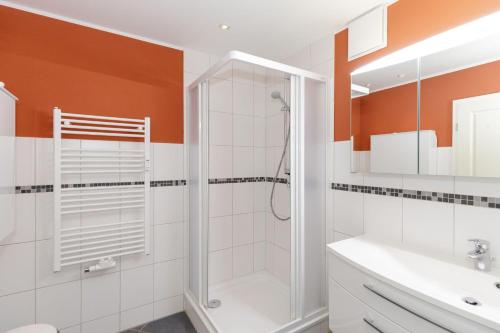 a bathroom with a shower and a sink at Urlaubstraeume-am-Meer-Wohnung-5-8-645 in Kühlungsborn