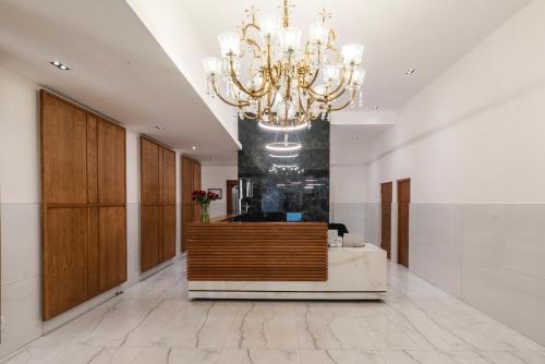a large lobby with a chandelier in a building at Xenia Aparthotel by Totalstay in Cape Town