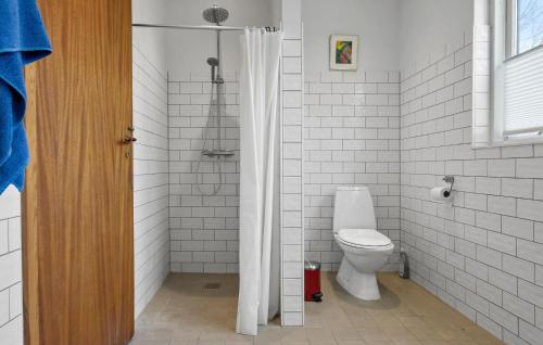 a white bathroom with a toilet and a shower at Lovely Home In Mern With Wifi in Mern