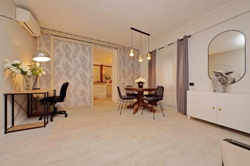 a dining room with a table and chairs at 4BNB - Ponte Milvio Apartment in Rome