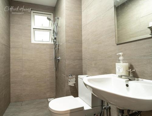 a bathroom with a sink and a toilet at Titiwangsa Monorial MRT LRT Station to Bukit Bintang Pavilion playground WTC HKL in Kuala Lumpur