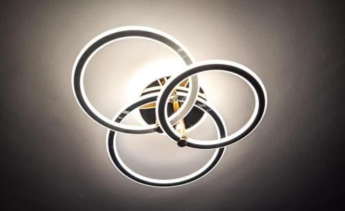 a ceiling light with a bunch of rings on it at 2BR Apartment in Mombasa - Pool & Near Beach in Mombasa