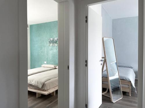Postel nebo postele na pokoji v ubytování B&B Colori Del Lago