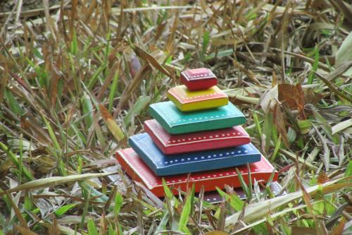 a stack of books sitting in the grass at Greenwoods Nature Camp in Mudumalai National Park