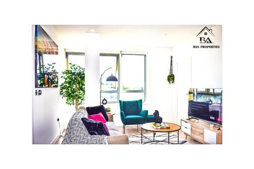 a living room with a couch and a table at Modern 2 Bed 2 Bath Bracknell with Free Parking in Bracknell