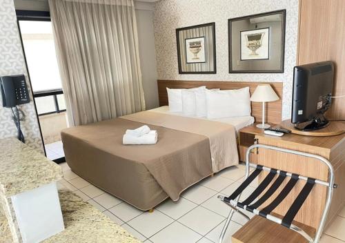 Кровать или кровати в номере Sun Square Suítes Hotel By Lual