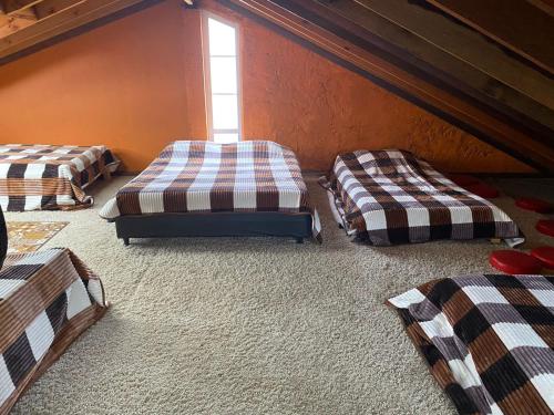 Una cama o camas en una habitación de El Peregrino