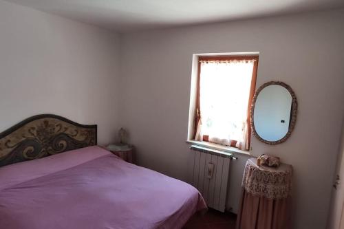 En eller flere senge i et værelse på Casa relax Pescocostanzo