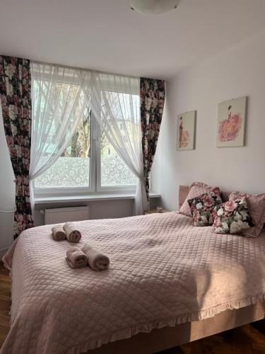 Postel nebo postele na pokoji v ubytování Apartament Marszałkowska
