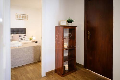 a bedroom with a bed and a glass door at BelMonStays Lubina del Sol, Riviera, Mijas Costa in Mijas Costa