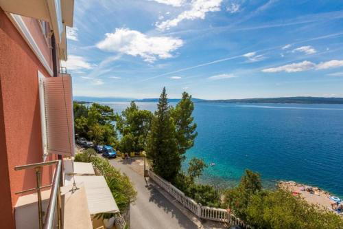 a view of the ocean from a building at Apartment Golden Sun in Dramalj