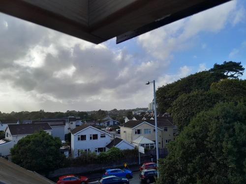 a view of a city with cars parked in a parking lot at Singleton Short Stay Basic Loft Rooms in Swansea