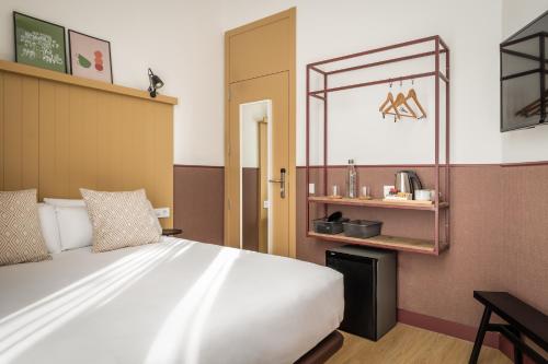 Кровать или кровати в номере BYPILLOW Ramblas