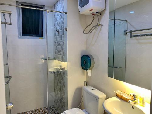 a bathroom with a shower and a toilet and a sink at 2 Bedrooms Scenic valley Big Free: Breakfast, Massage, More Discount Supermarket in Ho Chi Minh City