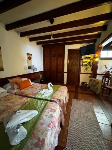 a bedroom with two beds with towels on them at Casa de colon in Los Silos