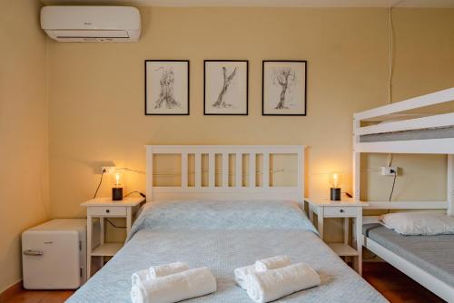 a bedroom with a bed and two bunk beds at Garda Doma in Brenzone sul Garda