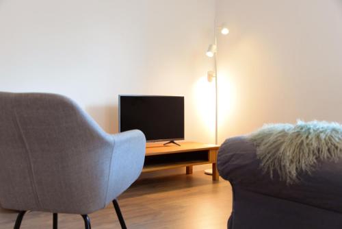 Een TV en/of entertainmentcenter bij Appartement Jolimont de 120m2
