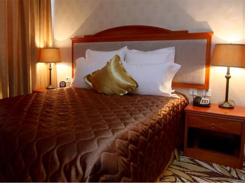 Postel nebo postele na pokoji v ubytování Buudai hotel