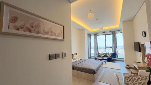 a bedroom with a bed and a living room at Private Studio Burj Khalifa Area -BEST PRICE in Dubai