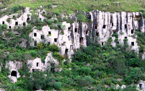 a mountain with many dwellings on the side of it at Al Barocco in Sortino