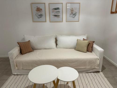 a living room with a couch and two tables at Excellent apartment brand new in San Isidro