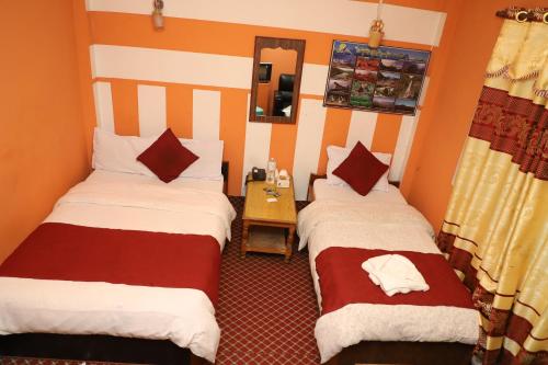 Postel nebo postele na pokoji v ubytování Hotel Pathibhara