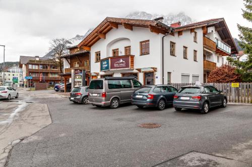 a group of cars parked in front of a building at Appartement by Blahut Vacation - og in Ehrwald