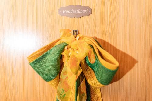 a pair of towels hanging on a wall at Haus am Wald in Bad Koetzting