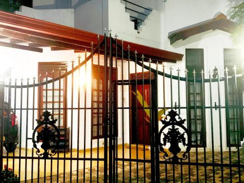 a wrought iron gate in front of a building at Matara Near Polhena & Mirissa Three Story House in Matara