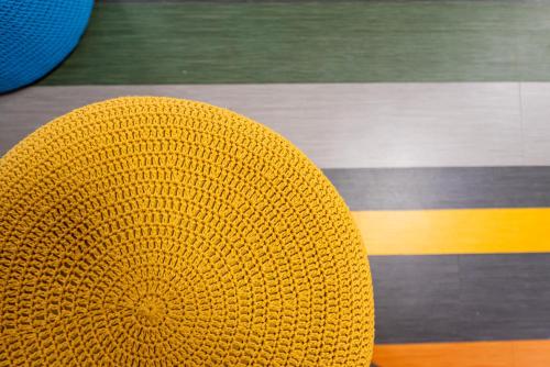 a yellow hat sitting on top of a table at ibis Styles Goiânia Shopping Estação in Goiânia