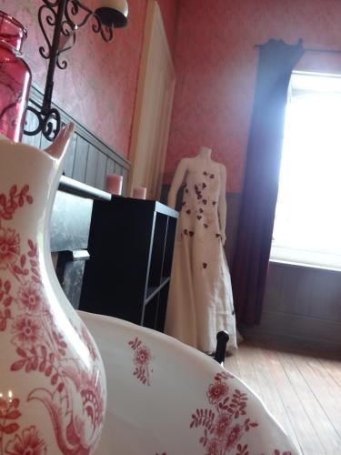 a dress on a mannequin in a room at Château de Nettancourt in Nettancourt
