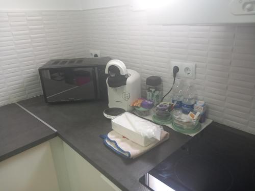 a kitchen counter with a toaster and a microwave at Buena Vista, Cehegin in Cehegín