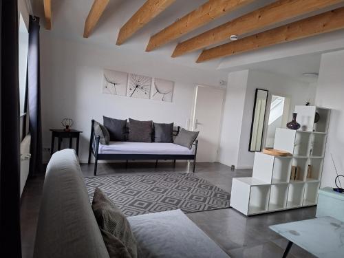 a living room with a couch and a table at Moderne Wohnung in Krefeld in Krefeld