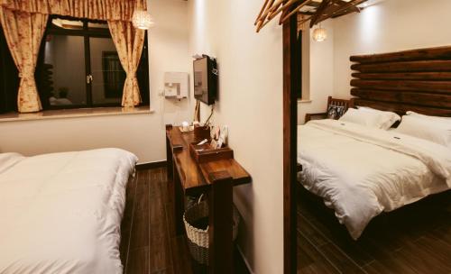 Cama o camas de una habitación en Hotel California Zhangjiajie