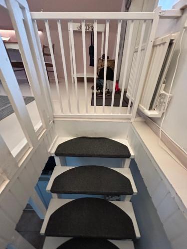 a stairway with two treads and two seats at Kungshagagård in Höllviken