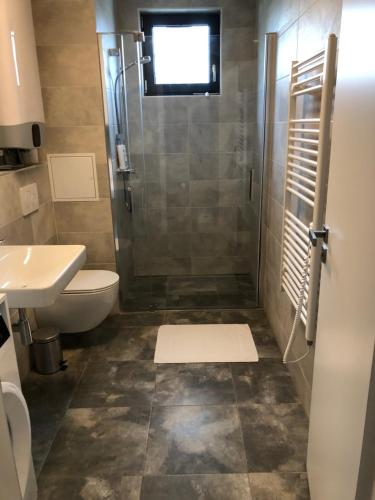Ein Badezimmer in der Unterkunft Apartmán X28