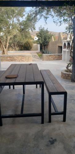 a wooden picnic table sitting on top of a patio at RIAD BERBERE in Taghazout