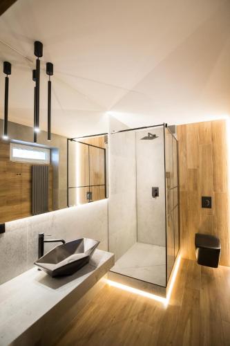 a bathroom with a sink and a shower at Na Górce in Przemyśl