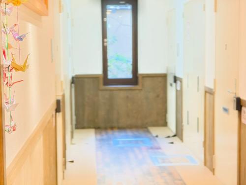 a hallway of an empty room with a window at Rest collection Fushimi-Inari Kyoto in Kyoto