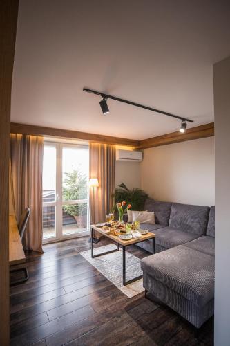 a living room with a couch and a table at Na Górce in Przemyśl
