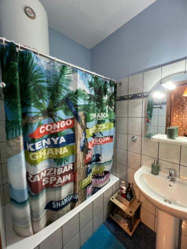 a bathroom with a large poster on the wall at Sweet Home Kerasias in Lambinoú